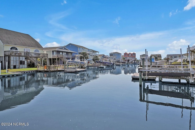 view of dock with a deck with water view