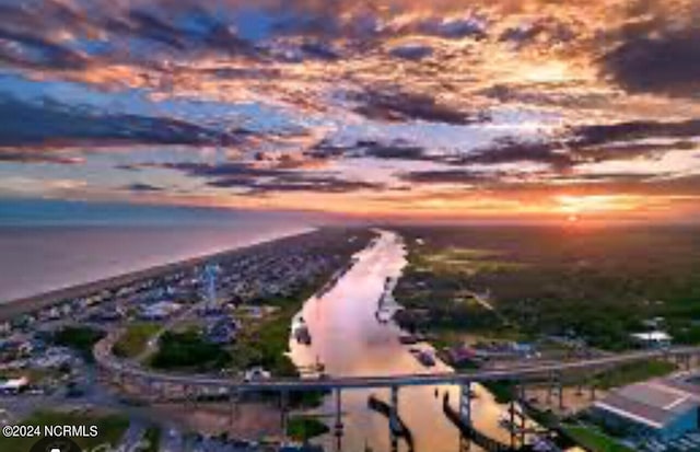 aerial view at dusk with a water view