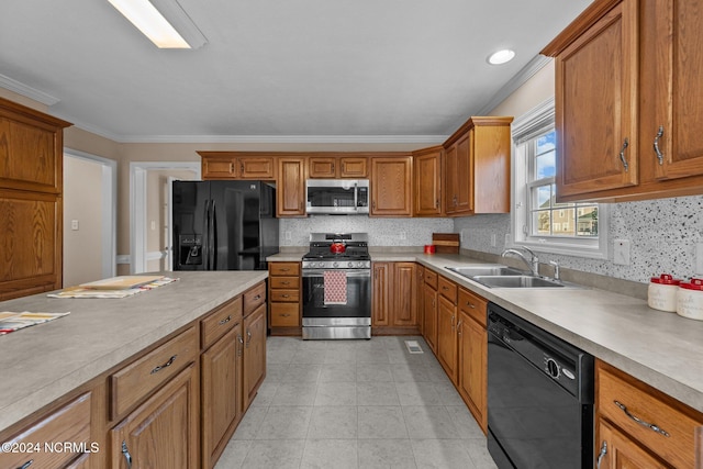 kitchen with crown molding, sink, decorative backsplash, and black appliances