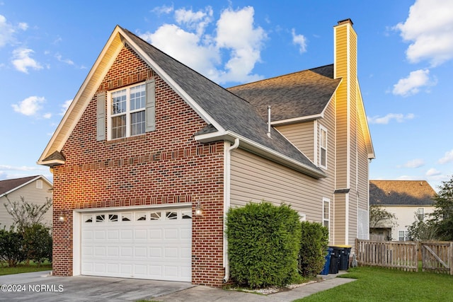 view of side of home featuring a garage