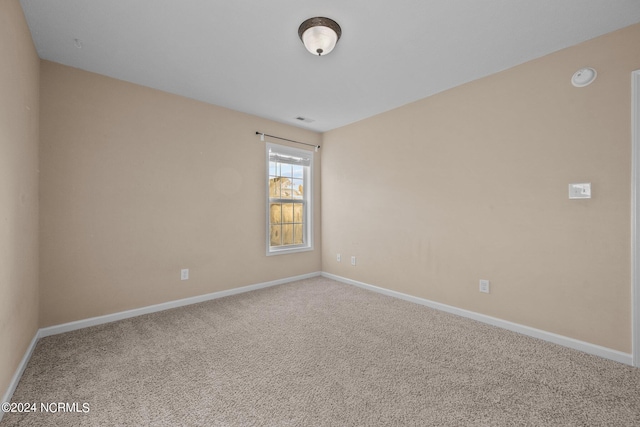 spare room with carpet floors