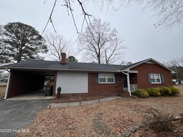 ranch-style house with a carport