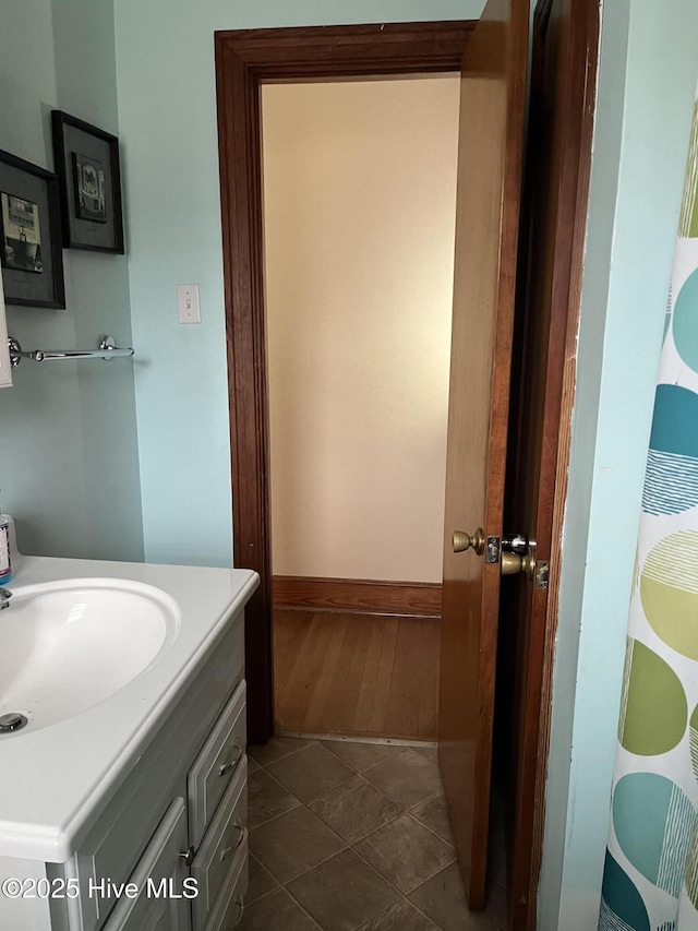 bathroom with tile patterned flooring and vanity