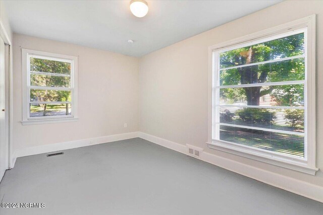601 S Andrews Ave, Goldsboro, NC 27530 - empty room featuring baseboards, visible vents, and a wealth of natural light
