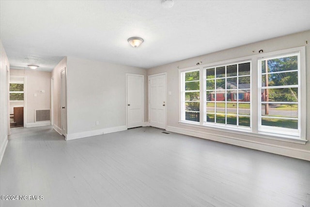 601 S Andrews Ave, Goldsboro, NC 27530 - unfurnished room with baseboards, wood finished floors, and visible vents