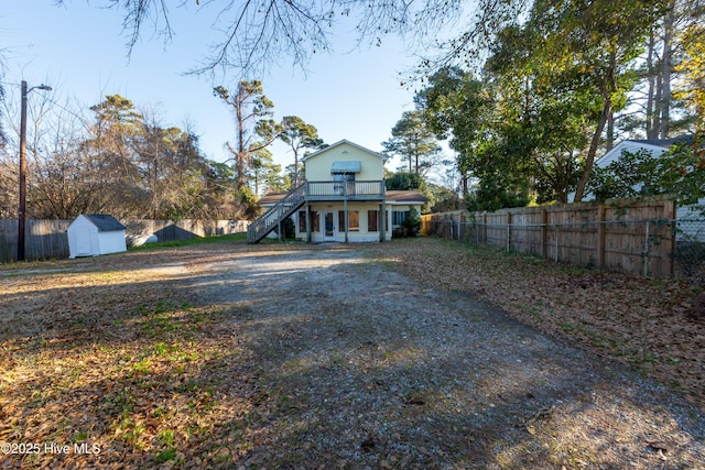 exterior space featuring a shed and a deck