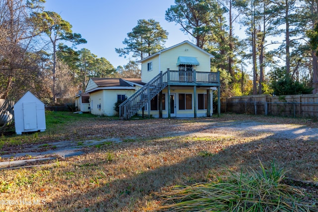 rear view of house with a shed