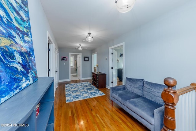 living area featuring wood finished floors and baseboards