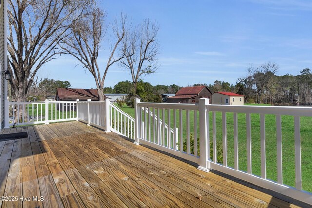 wooden deck with a yard