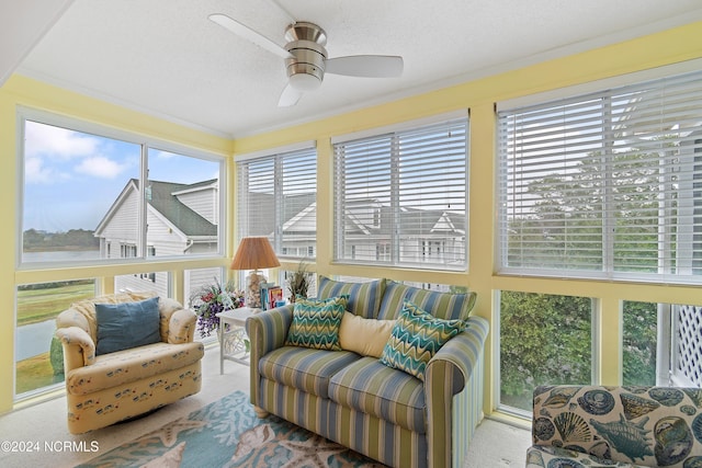 sunroom / solarium with ceiling fan