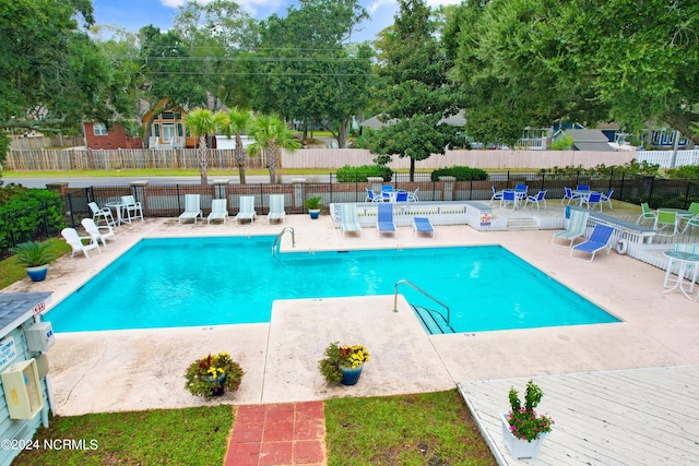 view of pool featuring a patio