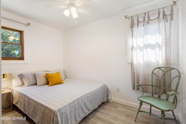 bedroom featuring ceiling fan and light wood-type flooring