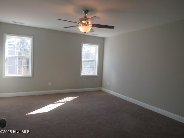 carpeted empty room featuring ceiling fan