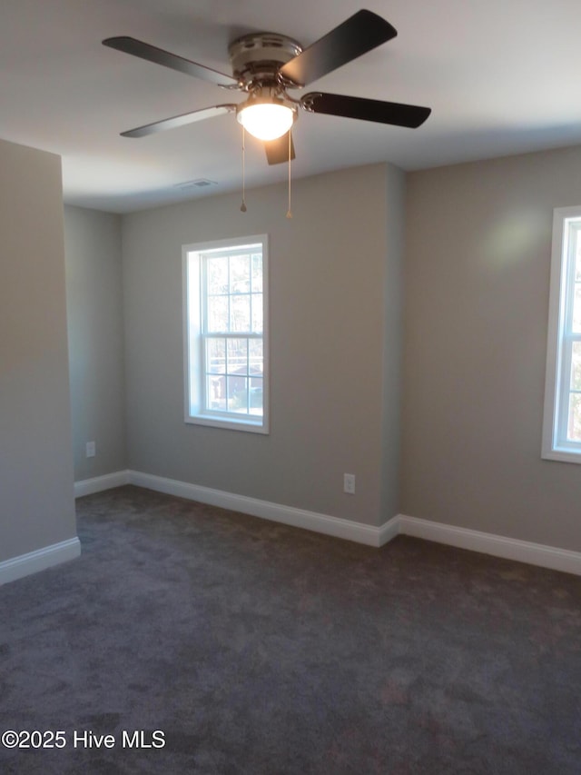 carpeted empty room with ceiling fan