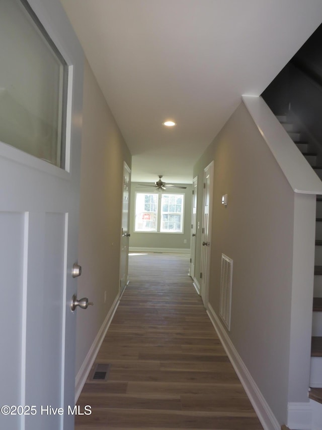 hall with dark hardwood / wood-style floors