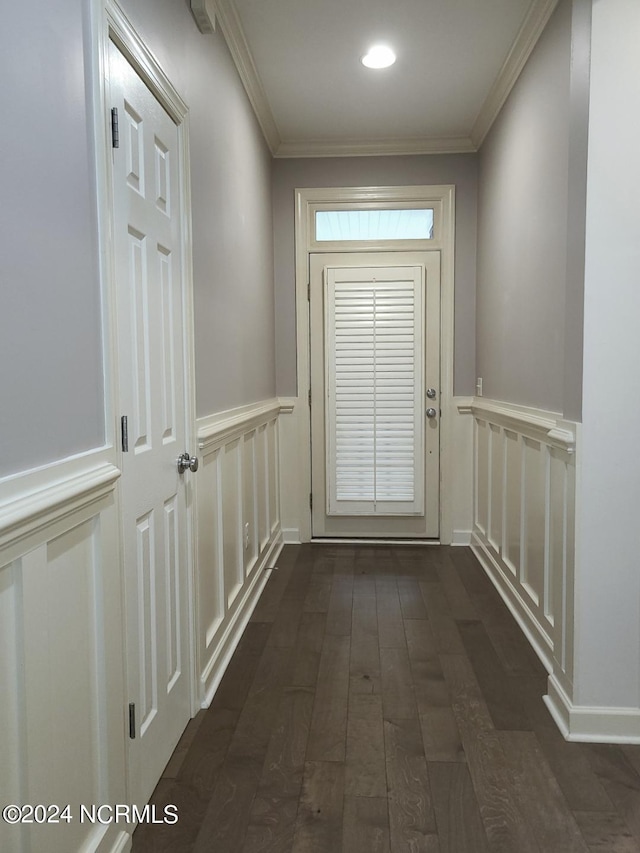 entryway featuring ornamental molding and dark hardwood / wood-style flooring