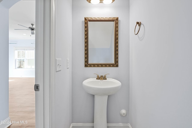 bathroom featuring hardwood / wood-style flooring and ceiling fan