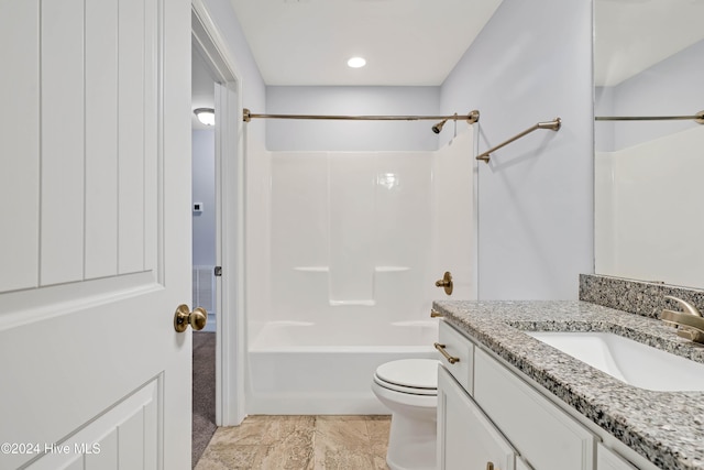 full bathroom with vanity, toilet, and  shower combination