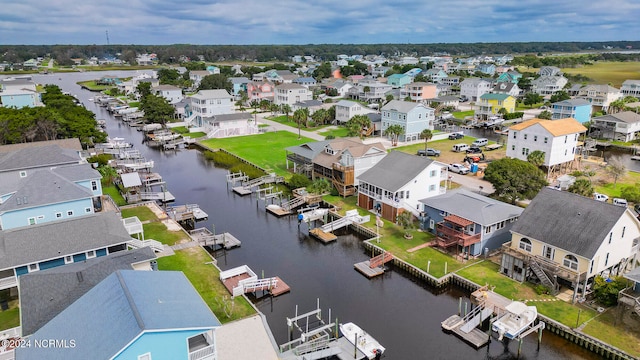 bird's eye view featuring a residential view and a water view