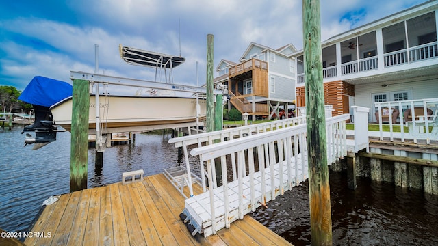 dock area featuring a water view and boat lift