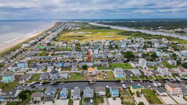 drone / aerial view featuring a water view and a residential view