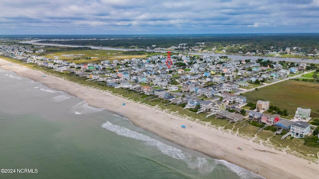 bird's eye view with a water view and a view of the beach