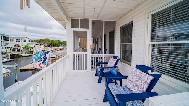 balcony featuring a water view