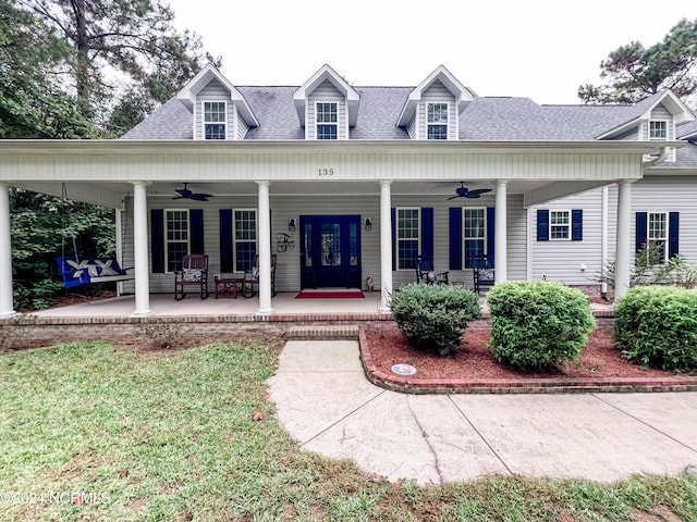 view of front of home featuring ceiling fan and a porch