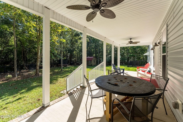 view of patio / terrace featuring ceiling fan and a shed