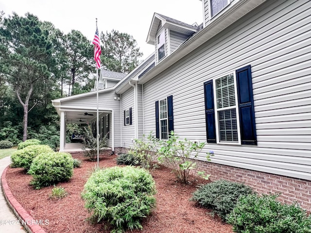 view of property exterior with covered porch