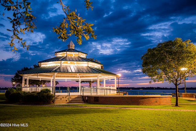 exterior space with a water view, a yard, and a gazebo