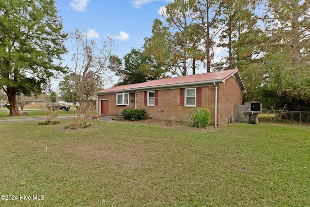 ranch-style home with a front lawn