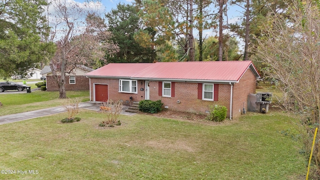 single story home featuring a front yard and a garage