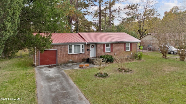 single story home with a garage and a front lawn