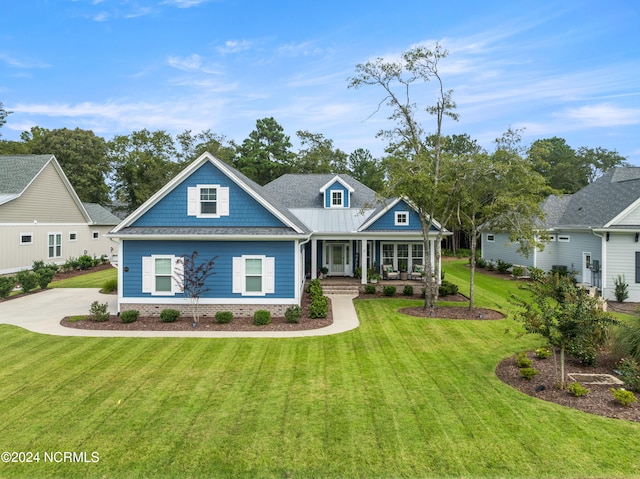 craftsman inspired home with covered porch and a front yard