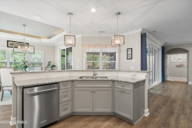 kitchen with dark hardwood / wood-style flooring, pendant lighting, sink, and stainless steel dishwasher