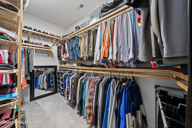 walk in closet featuring carpet floors