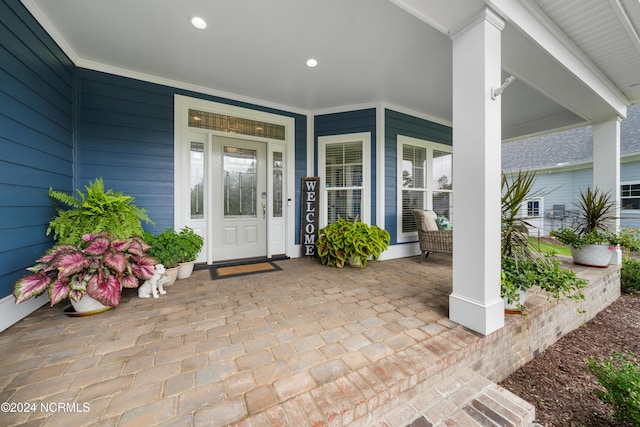 entrance to property with covered porch