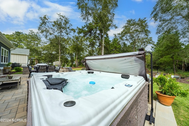 exterior space with a hot tub