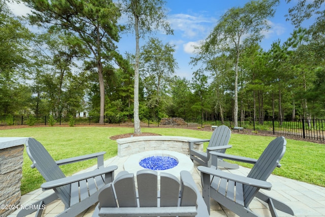 view of patio with a fire pit