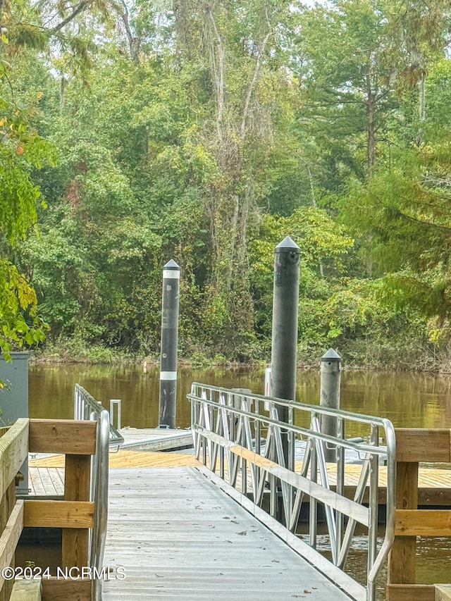 view of dock with a water view