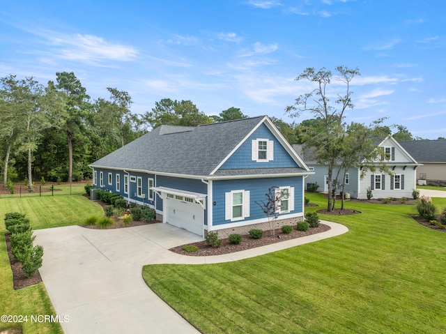 craftsman-style house featuring a front yard and a garage