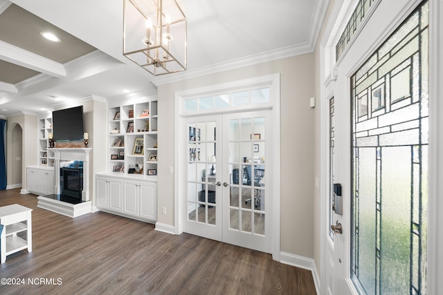 interior space featuring french doors, dark hardwood / wood-style floors, ornamental molding, and a chandelier