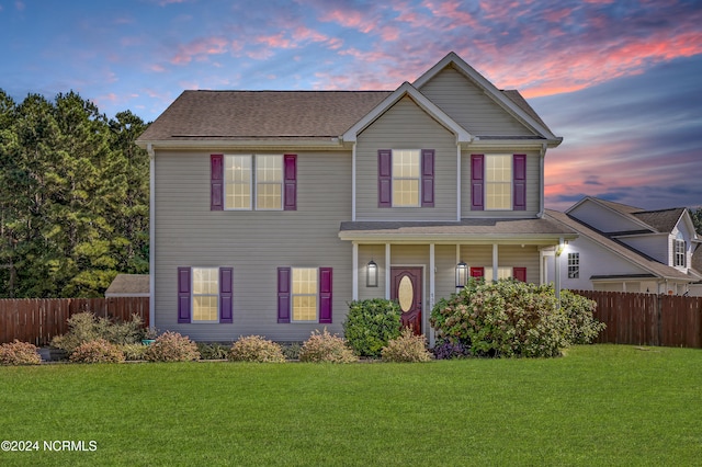 view of front of home with a yard