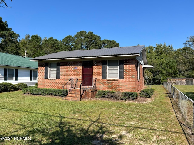 view of front of home with a front lawn