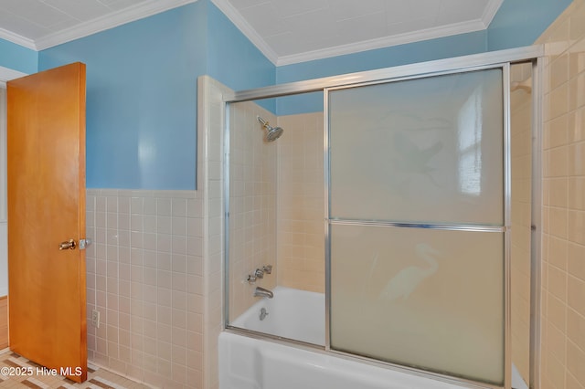 full bathroom with bath / shower combo with glass door, tile walls, and crown molding