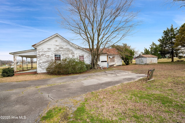 view of home's exterior featuring driveway