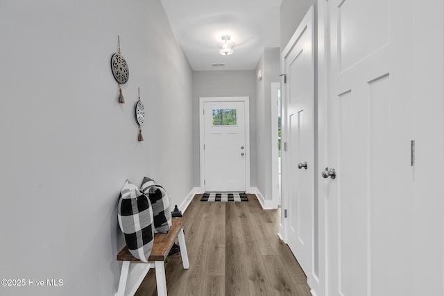 1399 Hammocks Beach Rd, Swansboro, NC 28584 - doorway featuring wood finished floors and baseboards