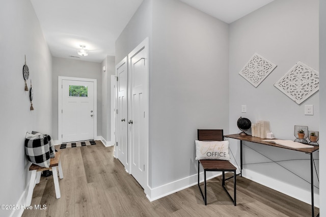 1399 Hammocks Beach Rd, Swansboro, NC 28584 - foyer featuring wood finished floors and baseboards