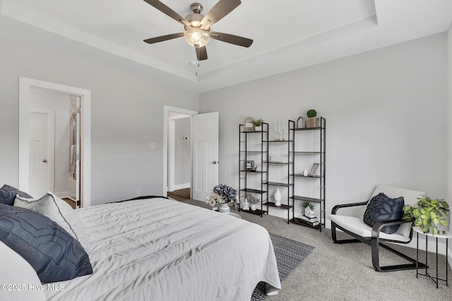1399 Hammocks Beach Rd, Swansboro, NC 28584 - bedroom with carpet floors, a raised ceiling, and a ceiling fan
